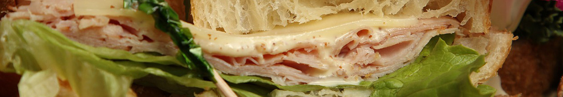 Eating Deli Italian Sandwich at Mangia Mangia Deli.